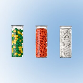 Three clear vials filled with different colored capsules.
