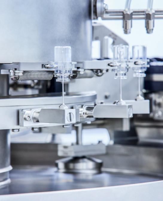 A machine that holds empty vials upside down