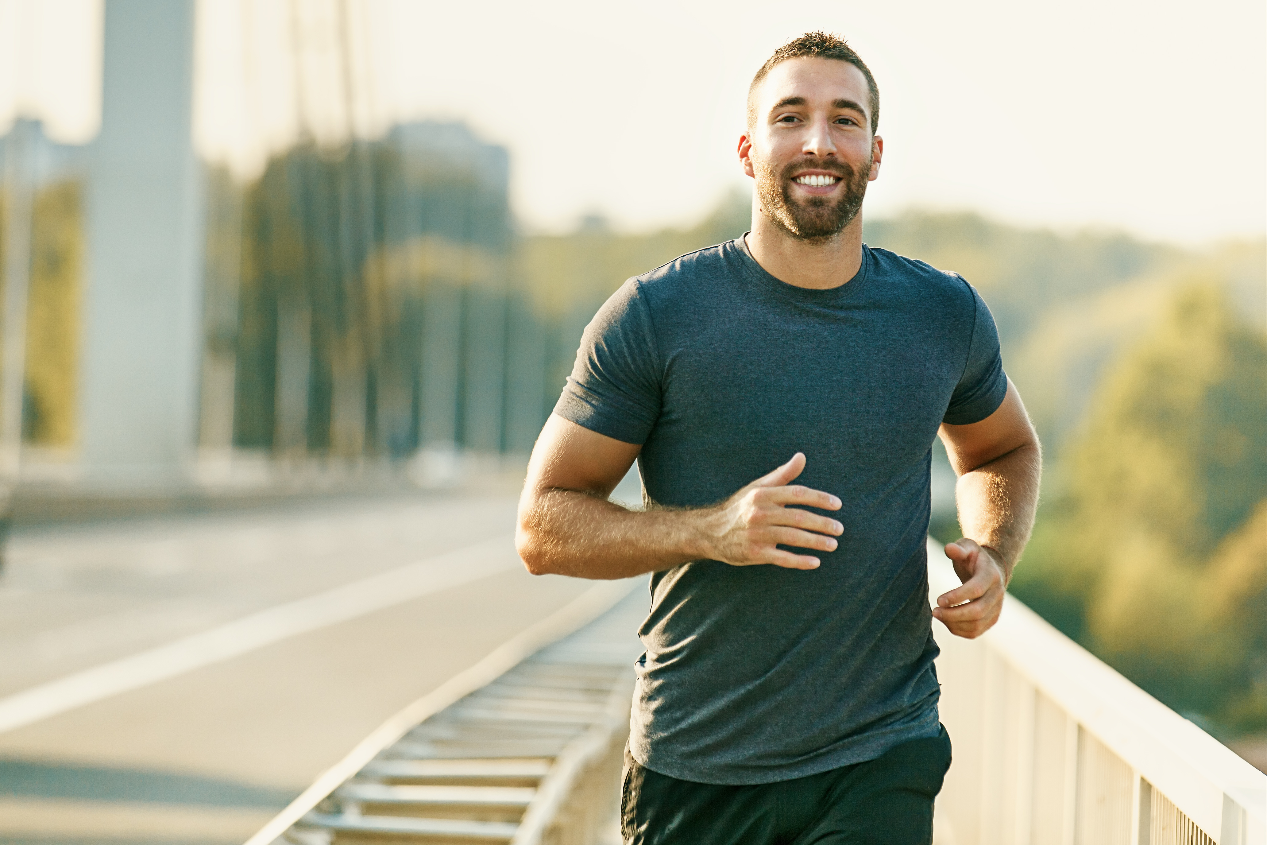 young man running and smiling